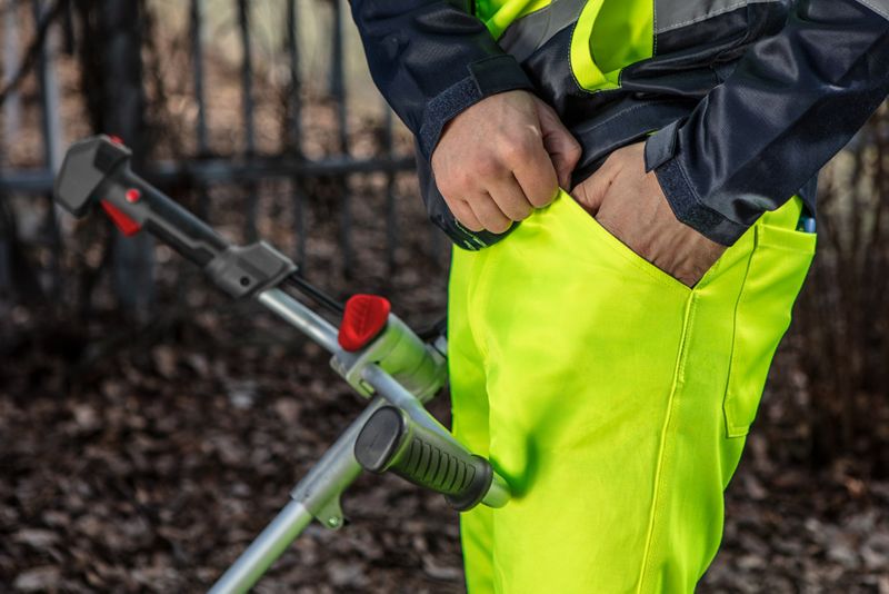 Unisex arbejdsbukser NEO TOOLS L i advarselsfarve, 1 stk.