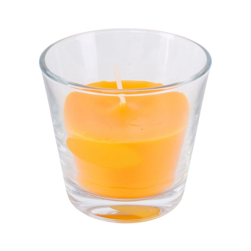 Gul-orange stearinlys i glas